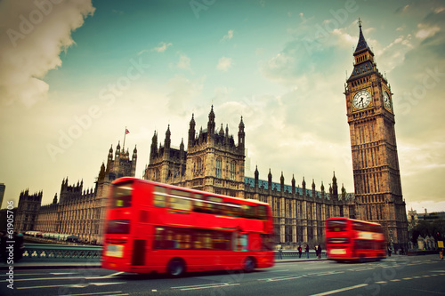 Fototapeta London, the UK. Red bus in motion and Big Ben