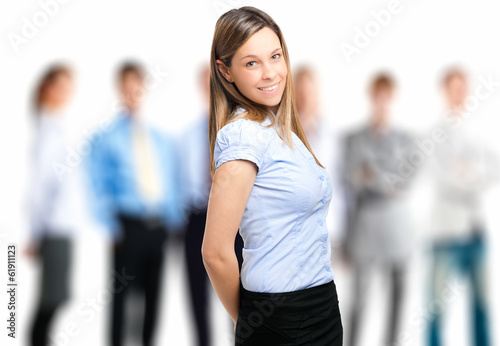 Photo: Smiling businesswoman with her team Smiling businesswoman with her team