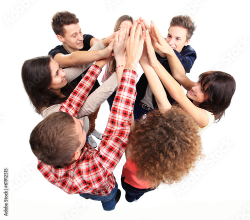 Photo: Pile of hands - Successful business team celebrating success Pile of hands - Successful business team celebrating success