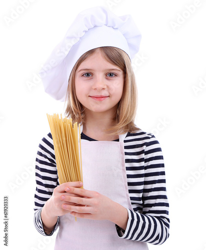 Photo: Beautiful little girl holding spaghetti isolated on white Beautiful little girl holding spaghetti isolated on white