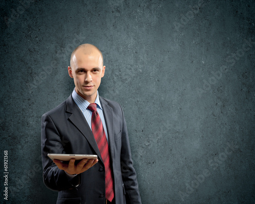 Photo: Man with tablet pc Man with tablet pc