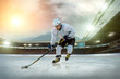Ice hockey player on the ice. Open stadium - Winter Classic game Ice hockey player on the ice. Open stadium - Winter Classic game