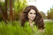 Teen girl resting over green field of grass, springtime. Nature Teen girl resting over green field of grass, springtime. Nature