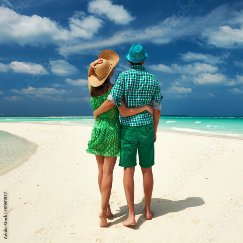 Photo: Couple in green on a beach at Maldives Couple in green on a beach at Maldives