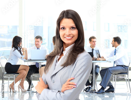 Photo: Business woman with her staff Business woman with her staff
