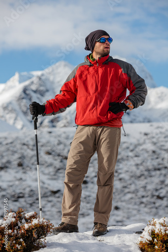 Photo: Hiker posing in Himalayas in front of big mountains Hiker posing in Himalayas in front of big mountains