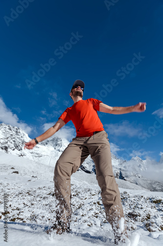 Photo: Hiker jumps in Himalaya mountains Hiker jumps in Himalaya mountains