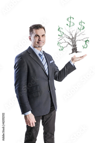 Photo: A businessman and a money tree in the palm of his hand A businessman and a money tree in the palm of his hand