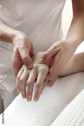 Photo: physical therapist massaging hands physical therapist massaging hands