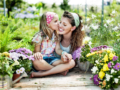 Photo: Mom and daughter have fun in the work of gardening Mom and daughter have fun in the work of gardening