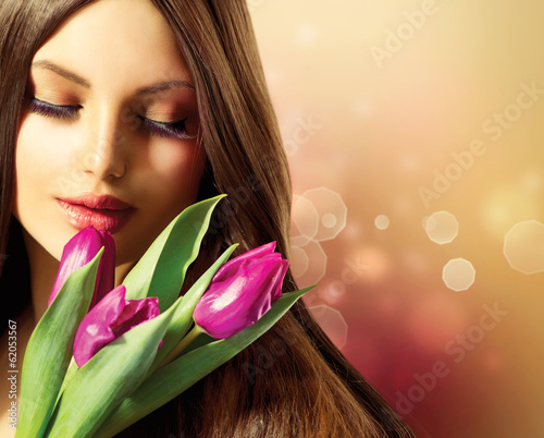 Photo: Beauty Woman with Spring Flower bouquet Beauty Woman with Spring Flower bouquet