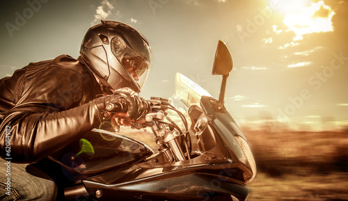 Photo: Biker racing on the road Biker racing on the road