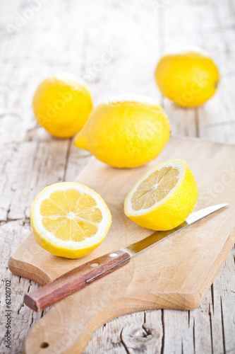 Photo: fresh lemons and knife fresh lemons and knife