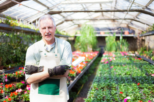 Photo: Greenhouse worker Greenhouse worker