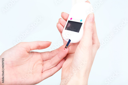 Photo: Measuring glucose level blood close-up Measuring glucose level blood close-up