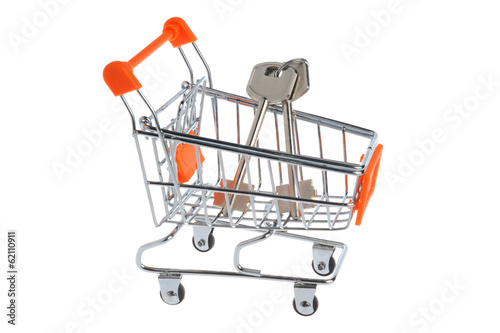 Photo: Shopping cart and keys within isolated on white Shopping cart and keys within isolated on white