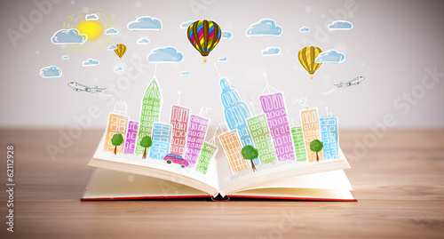 Photo: cityscape drawing on open book cityscape drawing on open book