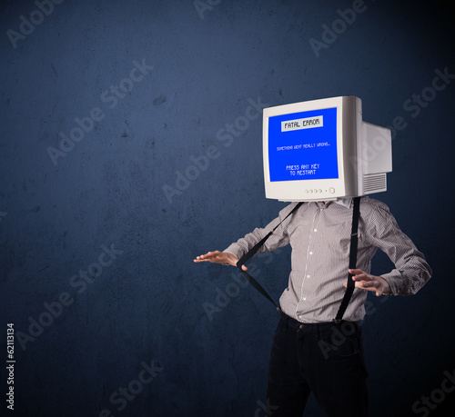 Photo: Person with a monitor head and fatal error blue screen on the di Person with a monitor head and fatal error blue screen on the di