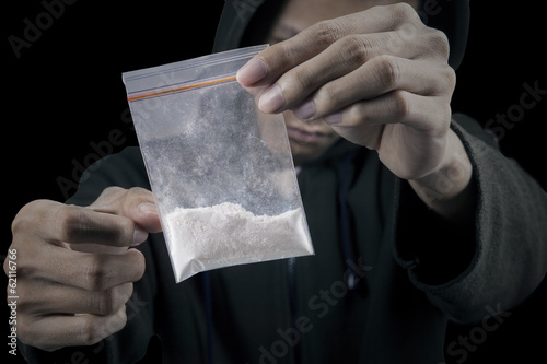 Photo: Man with packet of cocaine Man with packet of cocaine