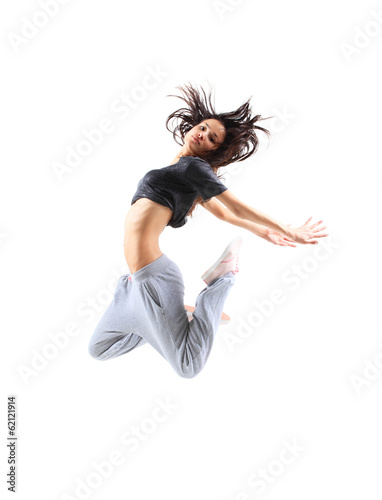 Photo: pretty modern slim hip-hop style teenage girl jumping dancing pretty modern slim hip-hop style teenage girl jumping dancing
