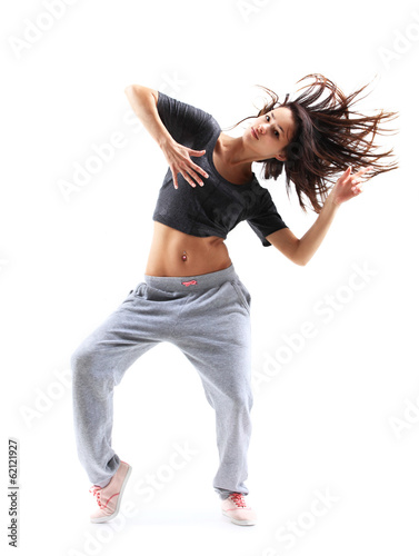 Photo: pretty modern slim hip-hop style teenage girl jumping dancing pretty modern slim hip-hop style teenage girl jumping dancing