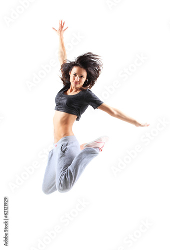 Photo: pretty modern slim hip-hop style teenage girl jumping dancing pretty modern slim hip-hop style teenage girl jumping dancing