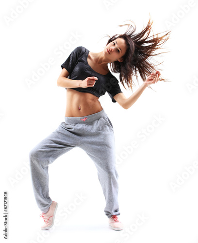 Photo: pretty modern slim hip-hop style teenage girl jumping dancing pretty modern slim hip-hop style teenage girl jumping dancing