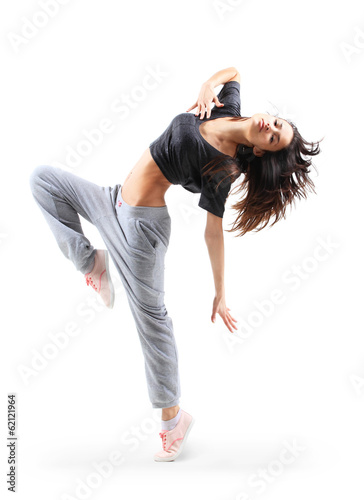 Photo: pretty modern slim hip-hop style teenage girl jumping dancing pretty modern slim hip-hop style teenage girl jumping dancing