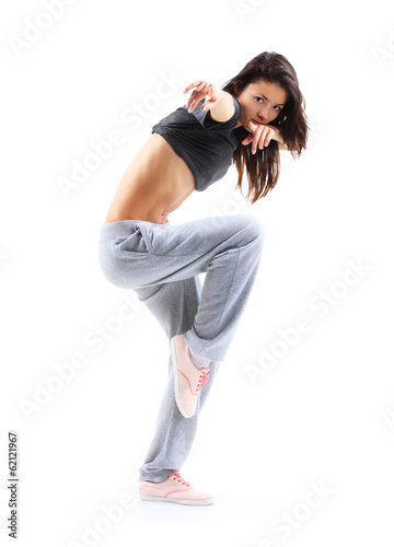 Photo: pretty modern slim hip-hop style teenage girl jumping dancing pretty modern slim hip-hop style teenage girl jumping dancing
