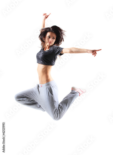 Photo: pretty modern slim hip-hop style teenage girl jumping dancing pretty modern slim hip-hop style teenage girl jumping dancing