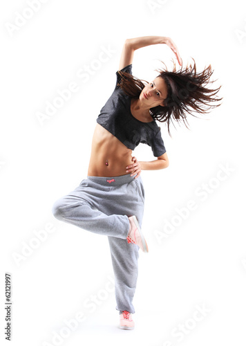 Photo: pretty modern slim hip-hop style teenage girl jumping dancing pretty modern slim hip-hop style teenage girl jumping dancing