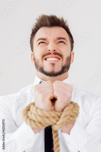 Photo: Tied up businessman. Tied up businessman.