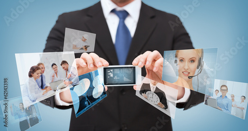 Photo: businessman with smartphone and news on screen businessman with smartphone and news on screen