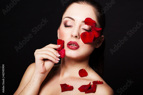 Photo: Fashion portrait of woman with rose petals Fashion portrait of woman with rose petals