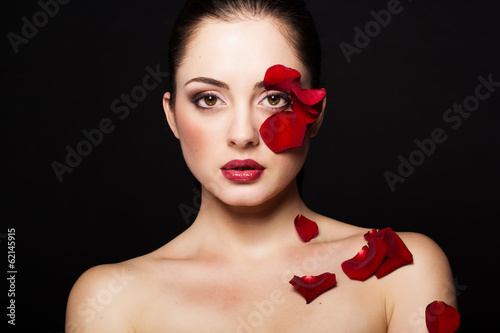 Photo: Fashion portrait of woman with rose petals Fashion portrait of woman with rose petals