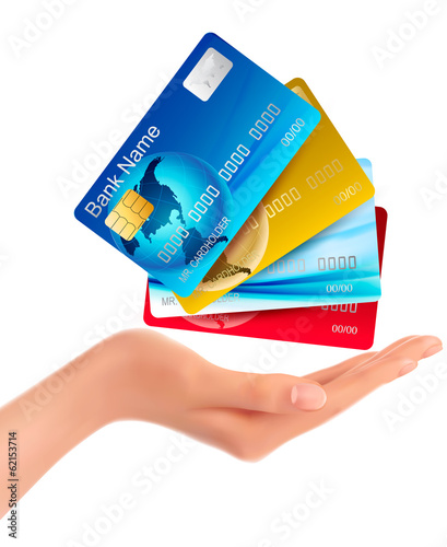 Vector: Hand holding credit cards. Vector illustration. Hand holding credit cards. Vector illustration.