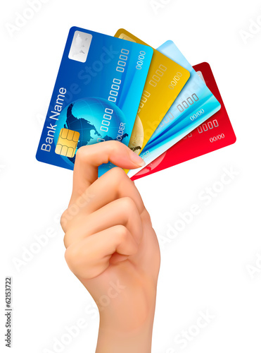 Vector: Hand holding credit cards. Vector illustration. Hand holding credit cards. Vector illustration.