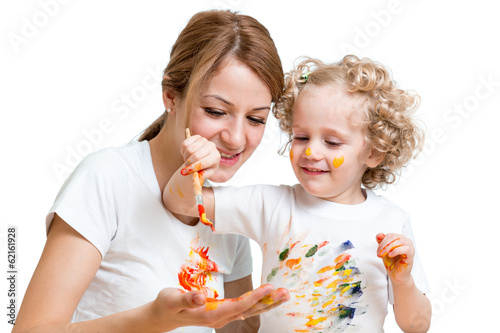 Photo: mother and kid girl painting together mother and kid girl painting together