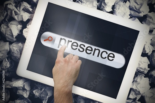 Photo: Hand touching presence on search bar on tablet screen Hand touching presence on search bar on tablet screen