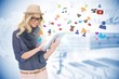 Stylish blonde using tablet pc with app icons Stylish blonde using tablet pc with app icons