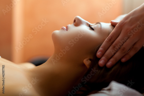 Photo: Woman receiving a head massage Woman receiving a head massage