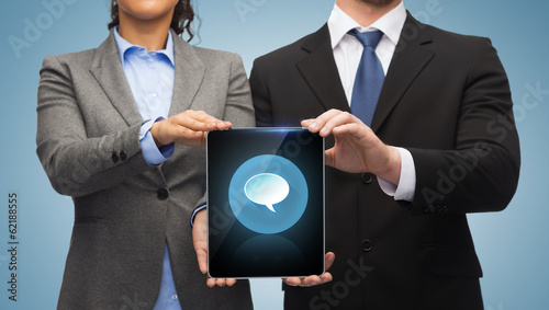 Photo: businessman and businesswoman with tablet pc businessman and businesswoman with tablet pc