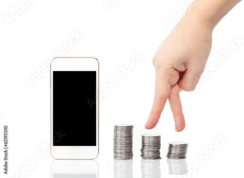 Photo: isolated female hand up the steps of the coins to the white phon isolated female hand up the steps of the coins to the white phon