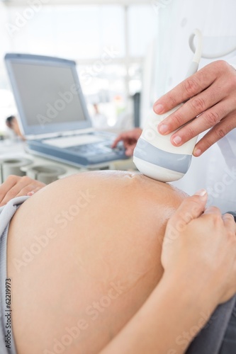 Photo: Expectant woman receiving ultrasound Expectant woman receiving ultrasound