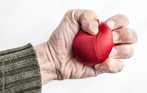 Photo: Hand of stressed man squeezing ball Hand of stressed man squeezing ball