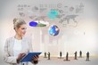 Blonde businesswoman using tablet pc with interface Blonde businesswoman using tablet pc with interface