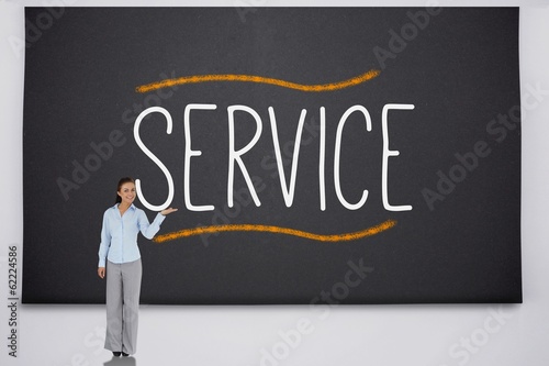 Photo: Businesswoman presenting the word service Businesswoman presenting the word service