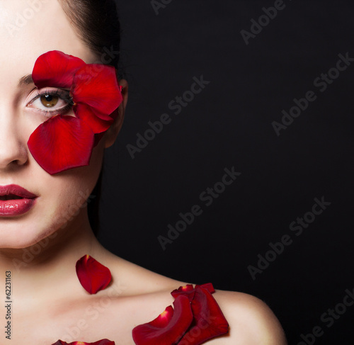 Photo: Fashion portrair of woman with rose petals Fashion portrair of woman with rose petals