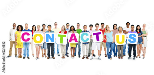 Photo: Multiethnic Group of Diverse People Holding Word Contact Us Multiethnic Group of Diverse People Holding Word Contact Us
