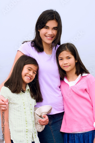 Photo: Three sisters together on foggy beach Three sisters together on foggy beach